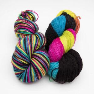 two skeins of neon black yarn. Skein 1 has been rewound so the colours are blended, skein 2 is as dyed.
