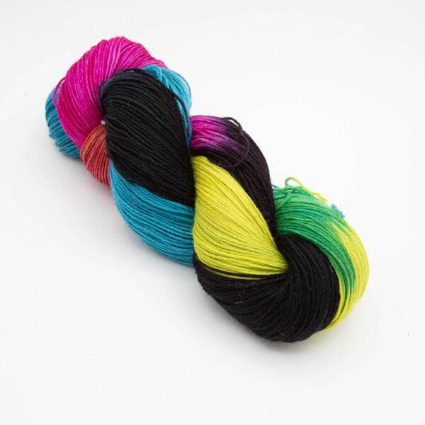 skein of neon black twisted up. The skein has not been rewound so the colours show as blocks.