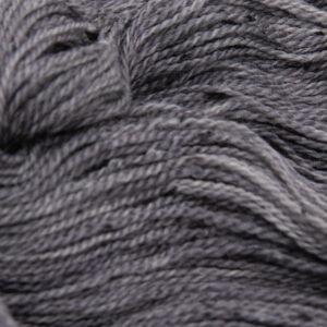 close up of charcoal grey coal tweed yarn with dark flecks