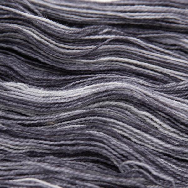 close up of charcoal grey Bluefaced Leicester and nylon yarn which has a high twist