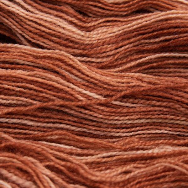 close up of copper Bluefaced Leicester and nylon yarn which has a high twist