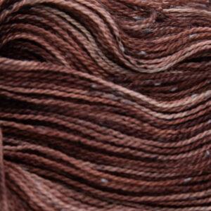 close up of dark copper tweed yarn with dark flecks