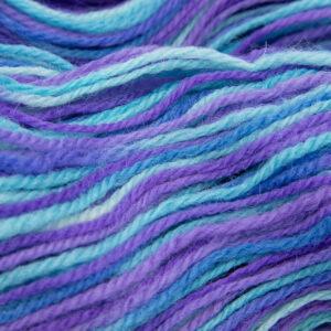 close up of kingfisher DK sock wool dyed with turquoise and purple