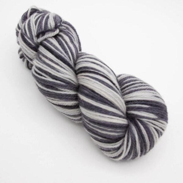 skein of thunder and lightening DK sock wool dyed in white and black