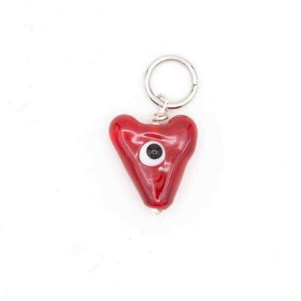 red lampwork glass stitch marker with single black and white eye and jump ring fitting