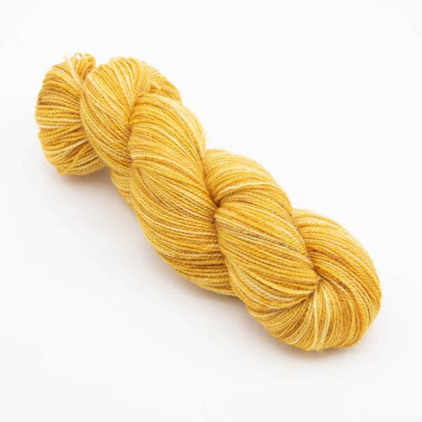 skein of hand dyed gold yarn