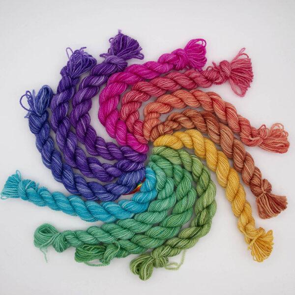 set of 12 mini skeins dyed in a hues colour wheel arranged in a spiral
