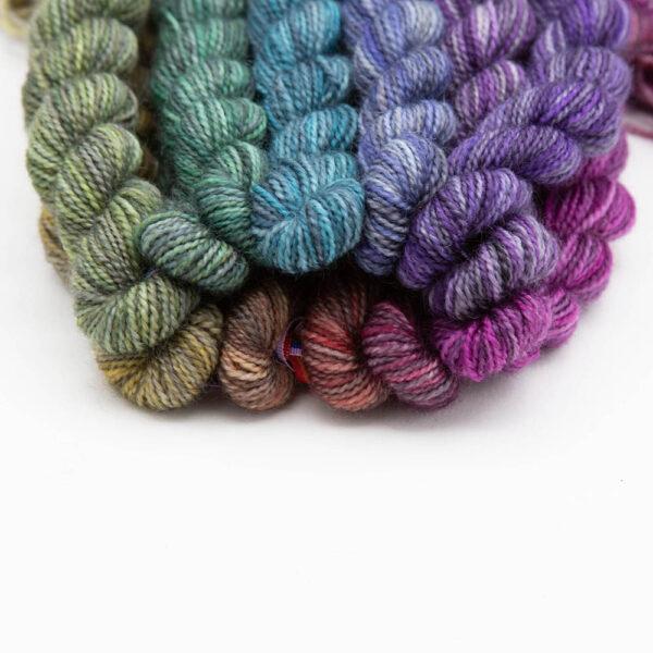 set of 12 mini skeins dyed in a shades colour wheel close up