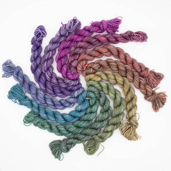set of 12 mini skeins dyed in a shades colour wheel arranged in a spiral